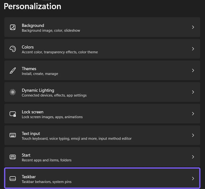 Windows 11 Personalization page with the Taskbar entry outlined in purple