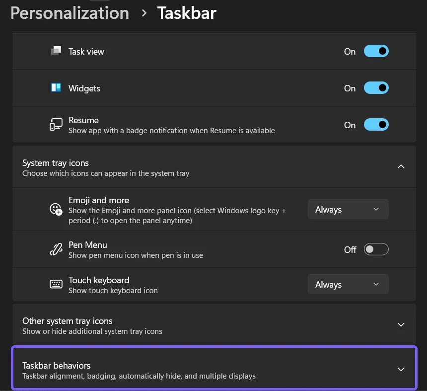 Windows 11 Personalization Taskbar page with Taskbar behaviors outlined in purple
